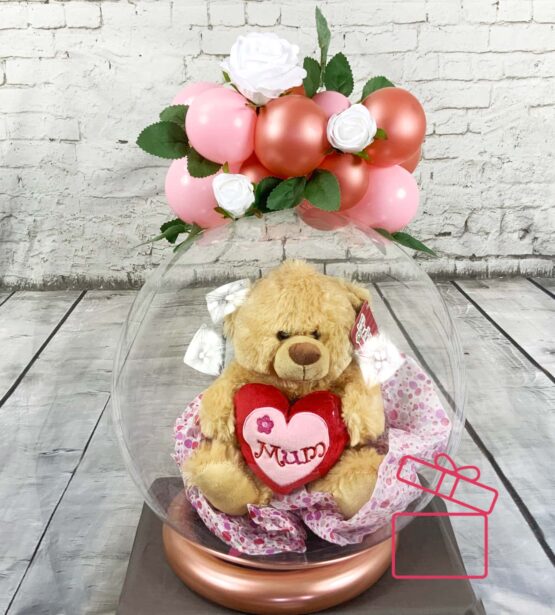 Adorable Surprise: Mother's Day Clear Balloon with Teddy Bear Inside Introducing our enchanting Mother's Day surprise: a Clear Balloon adorned with a cuddly Teddy Bear, topped with delicateflowers and balloons.